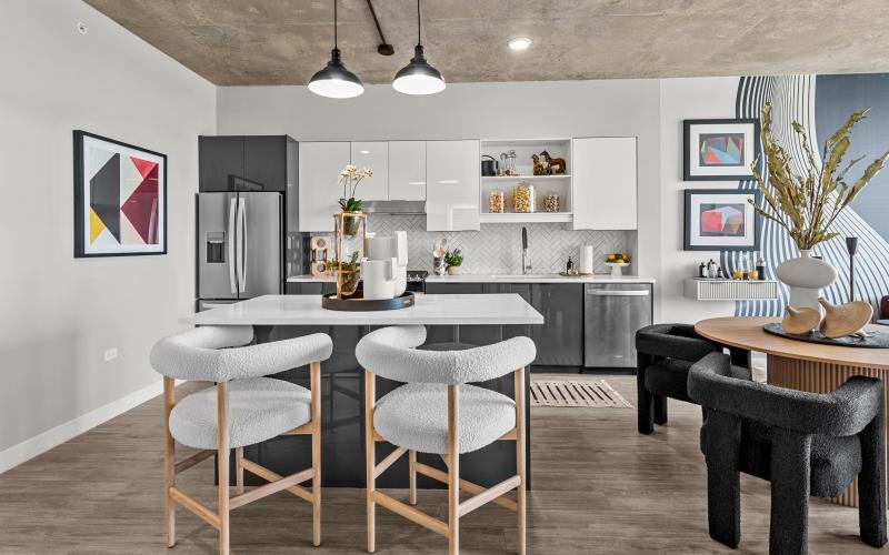 a kitchen with tables and chairs